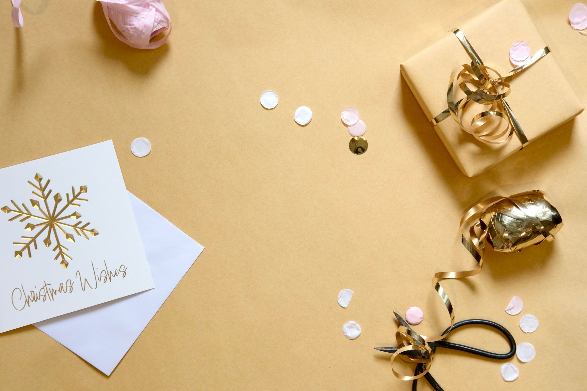 Wrapped wedding gift with a handwritten card on a table